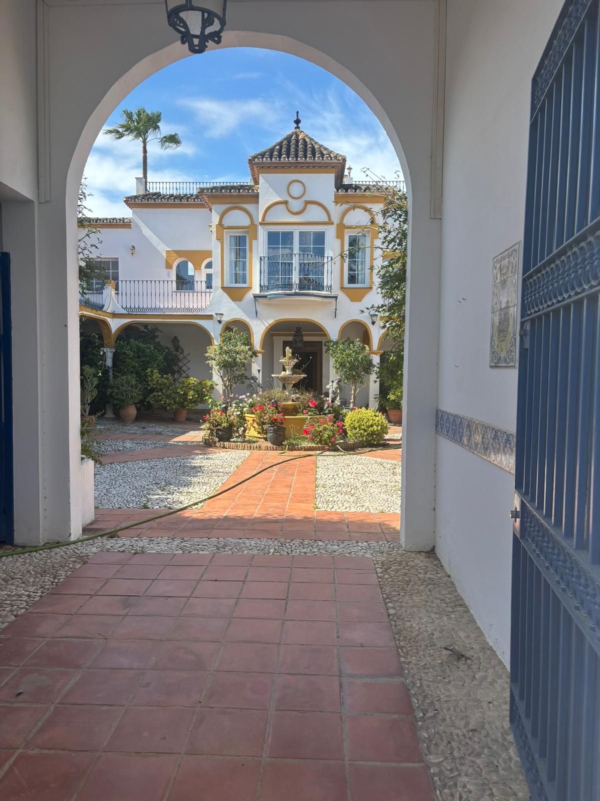 View through the archway into AIM School's courtyard