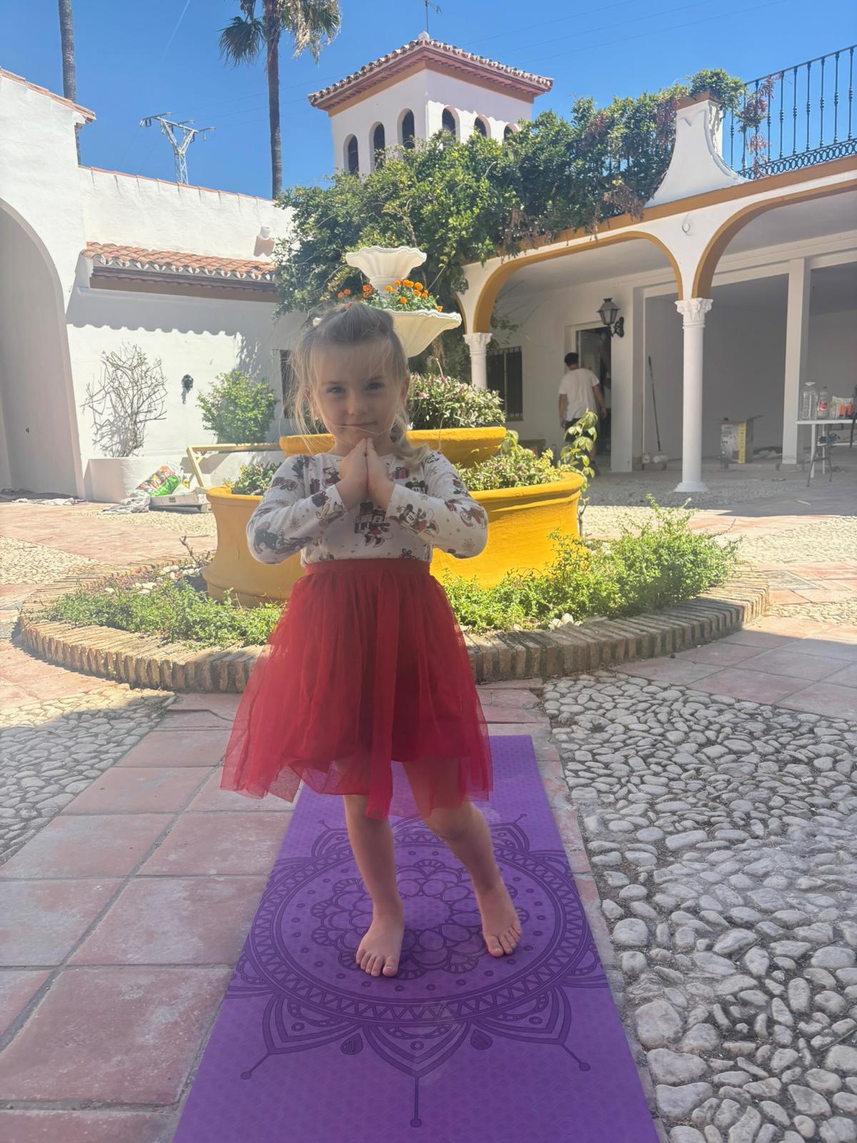 Daily yoga practice at AIM School